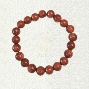 Red Goldstone bracelet with red-brown round beads and reflective speckles