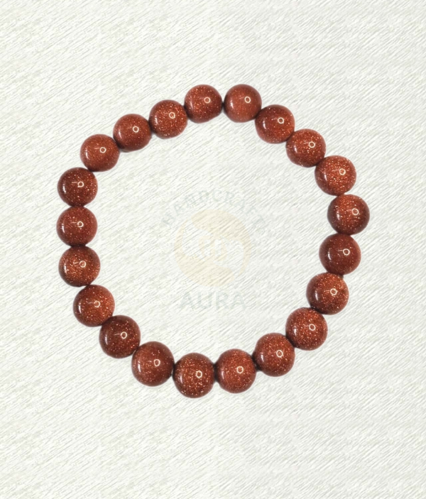 Red Goldstone bracelet with red-brown round beads and reflective speckles