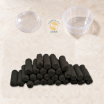 Pavitra Dhuni Dhoop Sticks, 30 pieces in a natural pile with an empty small container and separate lid.
