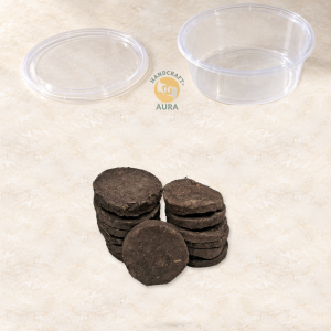 13 Pure Cow Dhoop Tikkis in two stacks and one leaning disc, with an empty big container and lid.